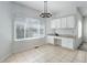 The dining area features a modern chandelier and a large window with bright natural light at 19058 E Hickock Dr, Parker, CO 80134