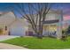 Charming two-story home with a well-manicured lawn, covered porch, and a two-car garage, providing an inviting curb appeal at 19058 E Hickock Dr, Parker, CO 80134