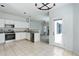 An open kitchen leads to a living room with a fireplace at 19058 E Hickock Dr, Parker, CO 80134