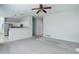 Large living room with open access to the kitchen and a view of the hallway at 19058 E Hickock Dr, Parker, CO 80134