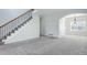 Spacious living room with staircase and neutral carpet at 19058 E Hickock Dr, Parker, CO 80134