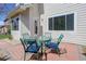 Brick patio with outdoor seating, adjacent to house and manicured yard at 19058 E Hickock Dr, Parker, CO 80134