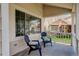 Cozy covered front porch with seating, offering a relaxing outdoor space at 19058 E Hickock Dr, Parker, CO 80134