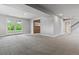 Finished basement area with carpet and sliding doors to the backyard at 2041 W Briarwood Ave, Littleton, CO 80120