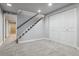 Finished basement area with carpet, stairway, and storage closet at 2041 W Briarwood Ave, Littleton, CO 80120