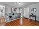 Bright entryway featuring hardwood floors, a built-in shelf, and stylish decor at 2041 W Briarwood Ave, Littleton, CO 80120