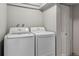 Bright laundry room featuring new LG washer and dryer with white walls and a closet for optimal storage at 2041 W Briarwood Ave, Littleton, CO 80120