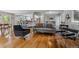 Open concept living area showcasing hardwood floors, neutral decor, and seamless flow at 2041 W Briarwood Ave, Littleton, CO 80120