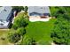Large, green backyard with a concrete patio, mature trees, and wooden fence at 7270 S Cherry Dr, Centennial, CO 80122