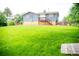 A well maintained backyard with a staircase and beautiful green grass at 7270 S Cherry Dr, Centennial, CO 80122