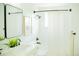 Bright bathroom featuring modern fixtures, a sleek vanity, and a shower with black hardware at 7270 S Cherry Dr, Centennial, CO 80122