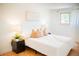 Cozy bedroom features a comfortable bed, wood floors, and soft, natural lighting at 7270 S Cherry Dr, Centennial, CO 80122