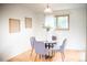 Cozy dining area with a glass table, four chairs, and a window view at 7270 S Cherry Dr, Centennial, CO 80122