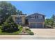 Charming two-story home with a two-car garage and landscaped front yard at 7270 S Cherry Dr, Centennial, CO 80122