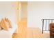 Well-lit hallway with hardwood floors and modern decor at 7270 S Cherry Dr, Centennial, CO 80122