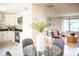 Open-concept space blends the dining area, kitchen, and living room at 7270 S Cherry Dr, Centennial, CO 80122