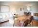 Inviting living room with hardwood floors and an adjacent dining area, perfect for entertaining at 7270 S Cherry Dr, Centennial, CO 80122