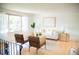 Bright living room features hardwood floors, large window and modern décor at 7270 S Cherry Dr, Centennial, CO 80122