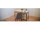 Bright office area featuring a modern desk, two chairs, and light hardwood floors at 7270 S Cherry Dr, Centennial, CO 80122