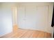 Bright room featuring hardwood floors and an entrance to additional rooms at 7270 S Cherry Dr, Centennial, CO 80122