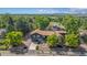 Aerial view showcasing this home's prime location with a long driveway and landscaped front yard at 14890 W 58Th Pl, Golden, CO 80403