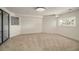 Finished basement with large windows, natural light and access to outdoor living space at 14890 W 58Th Pl, Golden, CO 80403