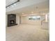 Finished basement with a cozy fireplace, recessed lighting, and neutral carpet at 14890 W 58Th Pl, Golden, CO 80403
