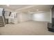 Spacious finished basement with a convenient wet bar and modern staircase at 14890 W 58Th Pl, Golden, CO 80403