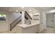Basement wet bar features modern fixtures, white cabinets, and sleek black countertops at 14890 W 58Th Pl, Golden, CO 80403