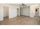 Spacious bedroom boasting hardwood floors, a ceiling fan, and a stylish accent wall at 14890 W 58Th Pl, Golden, CO 80403