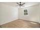 Well-lit bedroom featuring hardwood floors and a large window offering plenty of natural light at 14890 W 58Th Pl, Golden, CO 80403