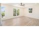 Bright, airy bedroom with large windows offering plenty of natural light and scenic views at 14890 W 58Th Pl, Golden, CO 80403