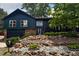 Charming multi-level home featuring stone accents, updated windows and a beautifully landscaped front yard at 14890 W 58Th Pl, Golden, CO 80403