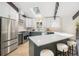 Contemporary kitchen boasting a large island, modern appliances, a skylight, and stylish cabinetry at 14890 W 58Th Pl, Golden, CO 80403