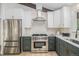 Updated kitchen with stainless appliances, modern cabinetry, and stylish countertops at 14890 W 58Th Pl, Golden, CO 80403