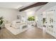 Bright main bedroom with vaulted ceiling, modern furnishings, and natural light at 14890 W 58Th Pl, Golden, CO 80403