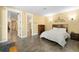 Spacious bedroom with private ensuite bathroom and hallway access at 17165 Colonial Park Dr, Monument, CO 80132