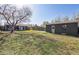 Large backyard with a detached garage and plenty of green space at 373 S Locust St, Denver, CO 80224