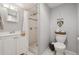 Modern bathroom featuring a shower, white vanity, and toilet at 373 S Locust St, Denver, CO 80224