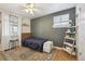 Cozy bedroom with a stylish rug, hardwood floors, and unique decorative touches at 373 S Locust St, Denver, CO 80224