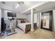 Cozy bedroom with a queen bed and a large mirror at 373 S Locust St, Denver, CO 80224
