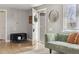 Inviting entryway featuring a decorative mirror, coat rack, and a bench with storage at 373 S Locust St, Denver, CO 80224