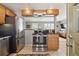 Updated kitchen featuring stainless steel appliances and tile flooring at 373 S Locust St, Denver, CO 80224