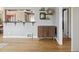 Comfortable living room with open layout featuring hardwood floors and modern shelving at 373 S Locust St, Denver, CO 80224