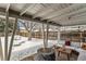 Cozy covered patio area with a fire pit and comfortable seating for outdoor relaxation at 373 S Locust St, Denver, CO 80224