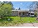 Spacious backyard features lush greenery, a small patio, and plenty of room for activities at 200 Perry St, Denver, CO 80219