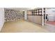 Large basement area with unique stone wall feature and a retro bar at 200 Perry St, Denver, CO 80219