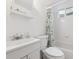 Clean, white bathroom with tub, shower and vanity at 200 Perry St, Denver, CO 80219