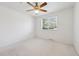 Cozy bedroom featuring a ceiling fan and a large window for ample natural light at 200 Perry St, Denver, CO 80219