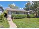 Inviting single-story home with tidy landscaping, showcasing a cozy and well-cared-for exterior at 200 Perry St, Denver, CO 80219
